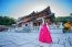 Woman With Hanbok In Gyeongbokgung,the Traditional Korean Dress