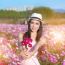 Young Woman Giving Bouquet Of Flowers