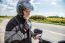 Man Motorcyclist In Protective Helmet Looking At Smartphone Disp