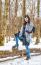 Young Beautiful Woman Walking Under A Snowfall