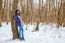 Young Beautiful Woman Walking In The Woods In Winter