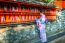 Asian Women Wearing Japanese Traditional Kimono Visiting The Beautiful In Fushimi Inari Shrine In Kyoto, Japan