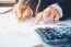 Businessman's Hands With Calculator At The Office And Financial