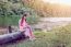 Young Girl Reading A Book In The Park