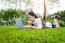 Young Woman Using Laptop In Park