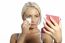 Young Woman Clean Face With Wet Wipes, Looking On Mirror In Hand