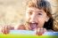 Beautiful Eight Year Old Girl Smiling On The Beach