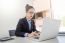 Attractive Women In Casual Business Sitting At A Table Working O