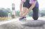 Cropped Shot Of Young Women Runner Tightening Running Shoe Laces