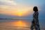 Woman Watching Sunset At The Beach