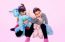 Happy Little Girls Holding  Unicorn Toys  Isolated On Pink