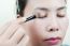 Asian Lady Doing Makeup