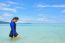 Asian Woman Walking In The Sea At Travel To Koh Lipe Island