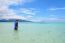 Asian Woman Walking In The Sea At Travel To Koh Lipe Island