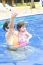 Mother And Baby In Swimming Pool