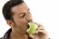 Man Eating Green Apple