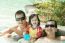 Happy Family In Swimming Pool