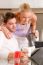 Couple In Kitchen Having Breakfast