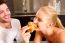 Couple In Kitchen Having Breakfast