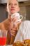 Woman At Home Having Breakfast