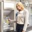 Young Woman Using Bank ATM