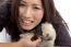 Smiling Female With Little Puppy