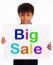 Small Boy Showing Big Sale Board