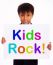 Small Boy With Kids Rock Board