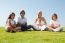 Happy Family Relaxing In Garden