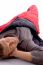 Man Resting In Sleeping Bag