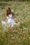 Young Woman walking In Meadow