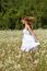 Young woman walking in meadow