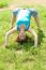 Girl Doing Gymnastic On Grass