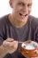 Smiling Man Eating Cornflakes