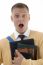 Shocked Male Student Holding Books