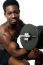 African Guy Lifting Dumbbells