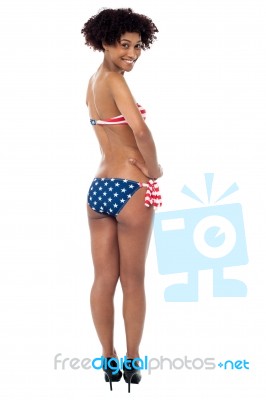 25 Years Young Woman In Swimsuit With American Flag Stock Photo