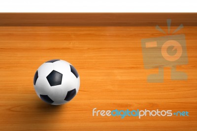 A Ball On Wooden Floor Stock Photo