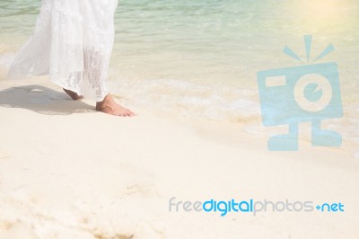 A Beautiful Carefree Woman Relaxing At The Beach Enjoying Her Su… Stock Photo