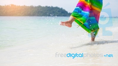 A Beautiful Carefree Woman Relaxing At The Beach Enjoying Her Su… Stock Photo