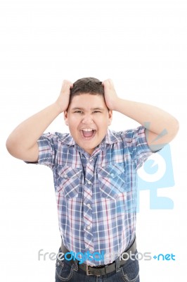 A Boy Screaming Loud With Mouth Wide Open Stock Photo