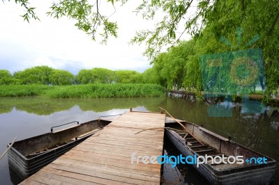 A Bridge And Boats  On The Lake Stock Photo