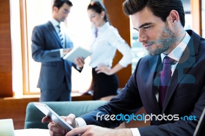 A Business Team Of Three In Office And Planning Work Stock Photo