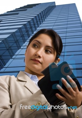 A Businesswoman Writing In A Personal Organizer Stock Photo