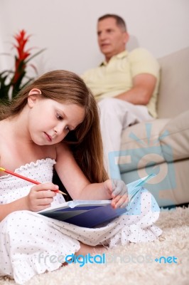 A Girl Doing Homework Stock Photo