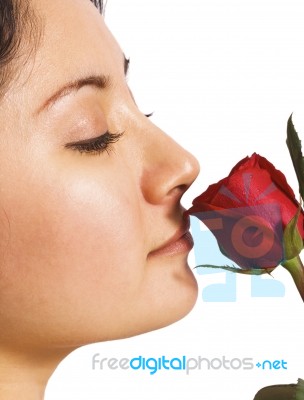 A Girl Smelling A Rose Stock Photo