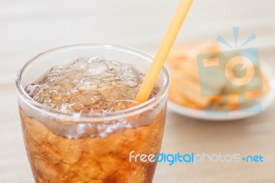 A Glass Of Cola With Snack On White Plate Stock Photo