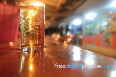 A Glass Of Whiskey On The Table Stock Photo