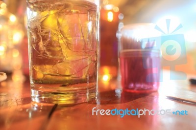 A Glass Of Whiskey On The Table Stock Photo