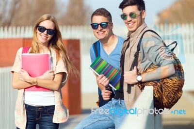 A Group Of Friends Talking In The Street After Class Stock Photo